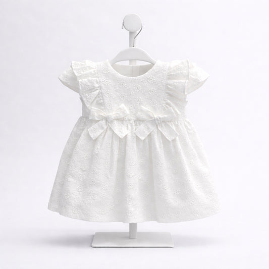 Vestido blanco para bebé niña con bordado y moño frontal