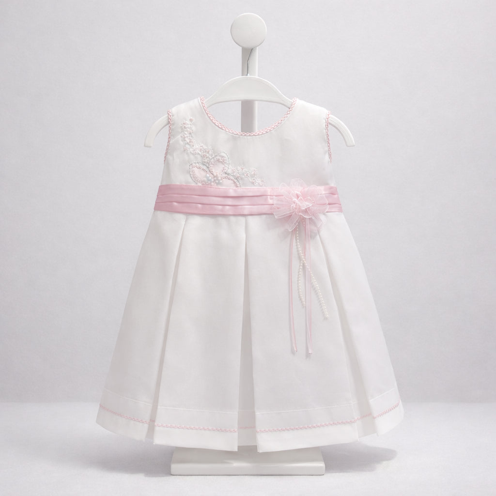 Vestido blanco para bebé niña con cinturón rosado y flor