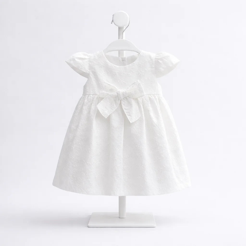 Vestido blanco para bebé niña con bordado y moño frontal