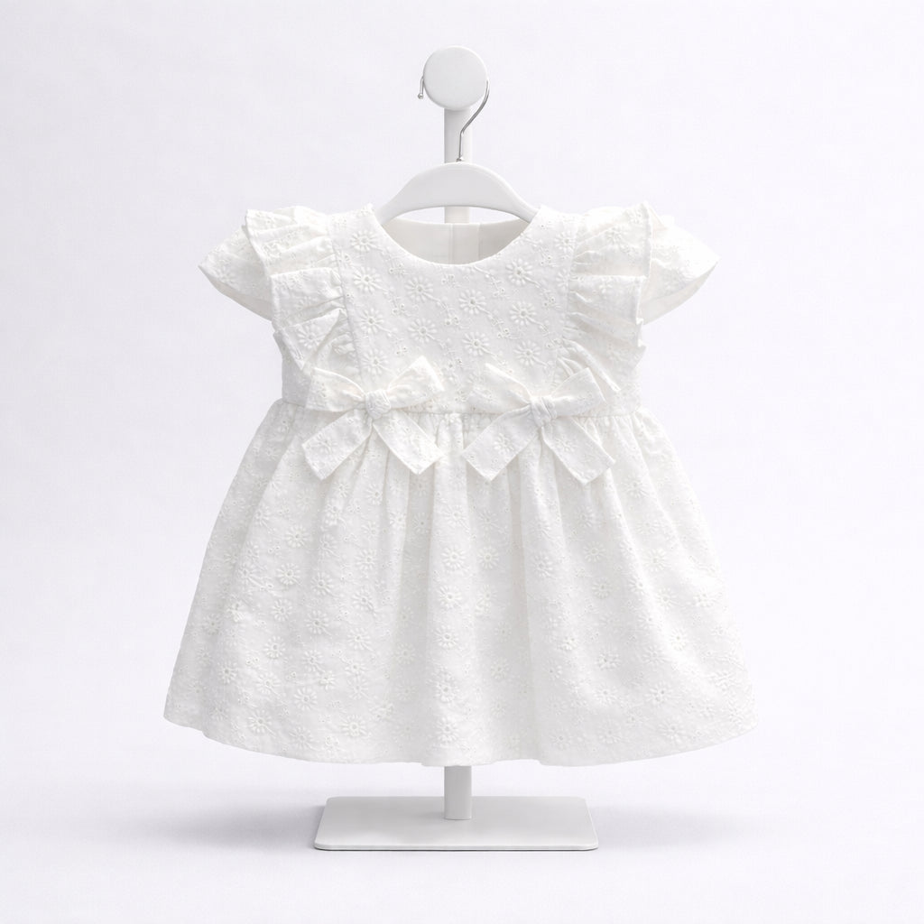 Vestido blanco para bebé niña con bordado y moño frontal